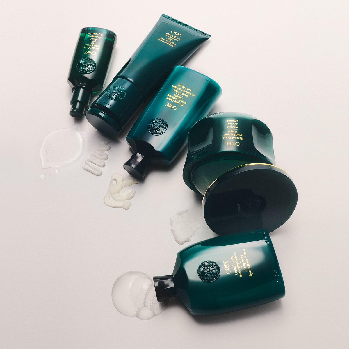 Oribe 6.7oz jar next to hand to show true size for shopping clarity