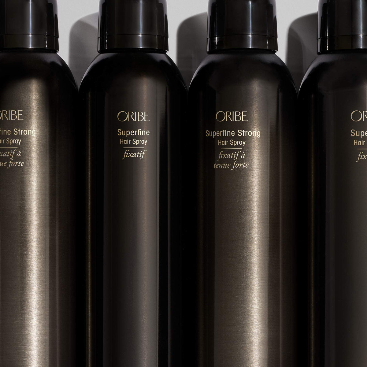 Oribe Superfine on styled hair in lifestyle setting showing long-lasting polish