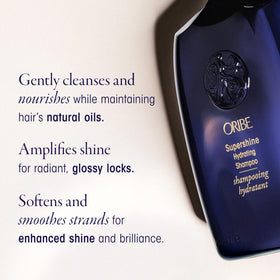 ORIBE bottle next to a hand for scale highlighting compact, travel-ready size