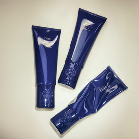 Oribe Supershine size scale with hand illustrating travel-friendly 5 oz