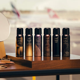 Oribe Thick Dry Finishing Spray nozzle close-up illustrating fine mist delivery for even volumizing coverage
