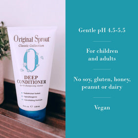 Original Sprout 12 oz bottle next to hand showing scale and travel-friendly size