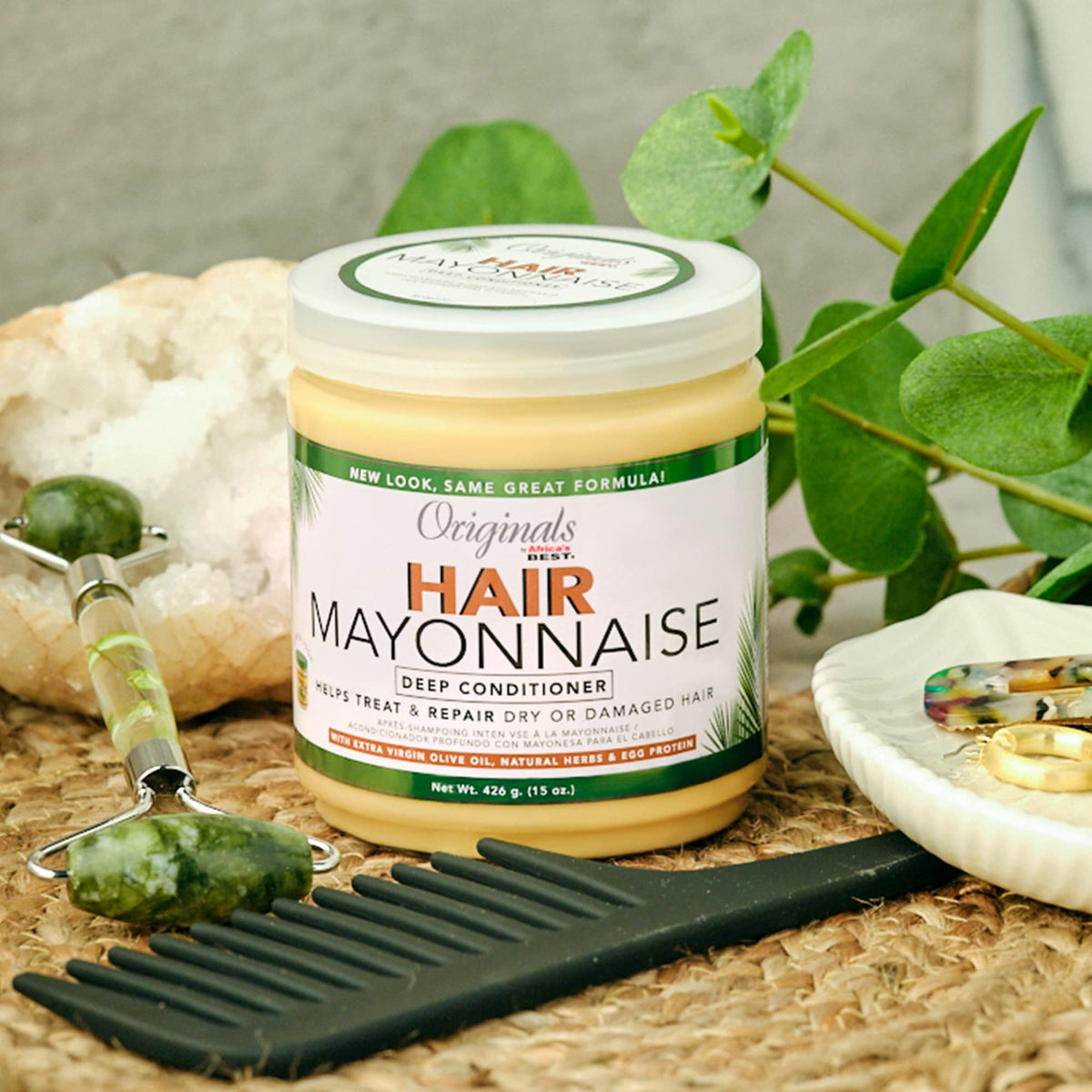 Originals by Africa's Best being applied to wet hair, detangles and softens benefit