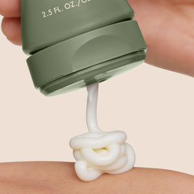 Open jar of Origins mask showing creamy contents and nourishing benefits