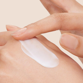 Origins Light Rose tube close-up highlights smooth tube finish and quick-absorbing texture benefit