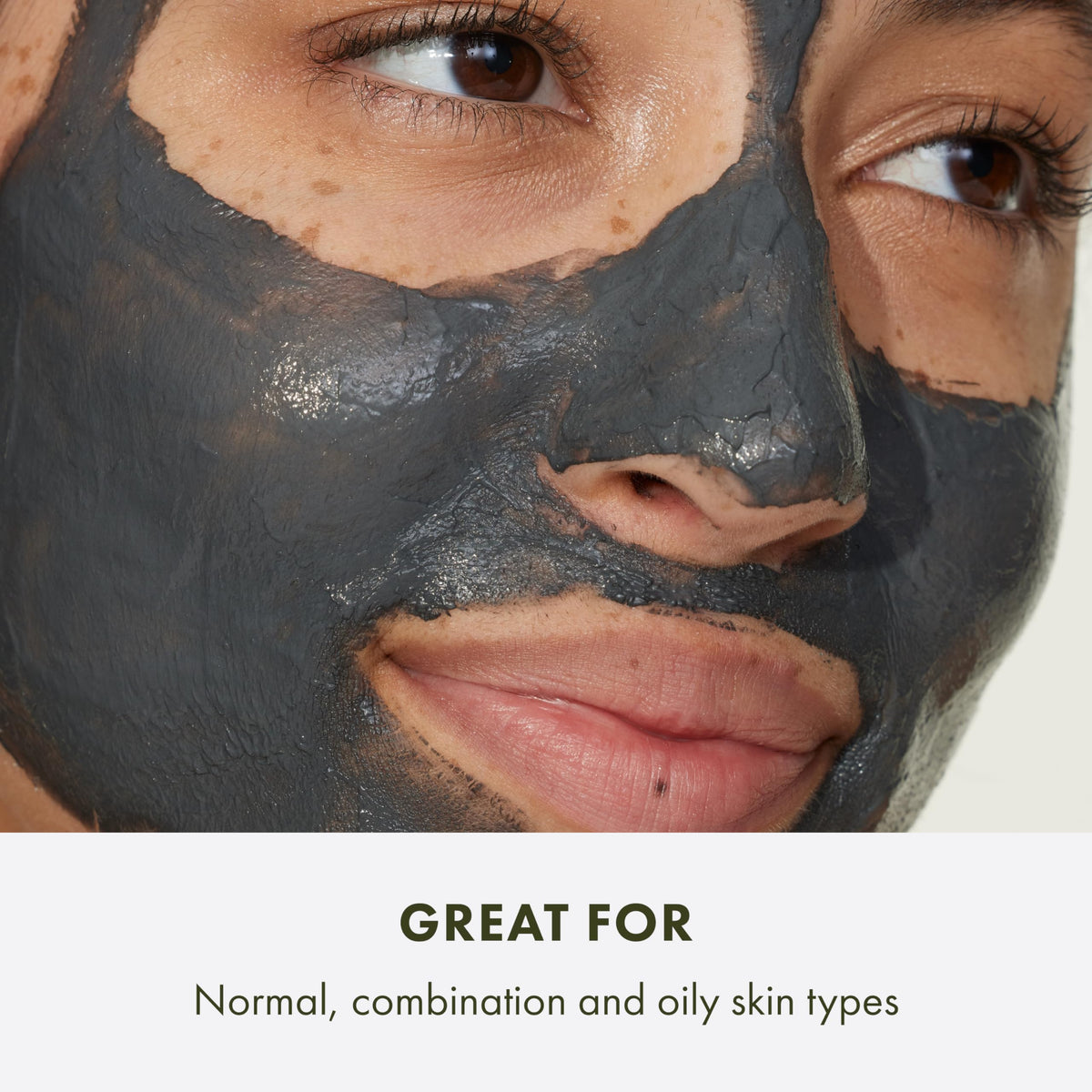 Origins jar beside bamboo charcoal and kaolin clay, showing natural active ingredients