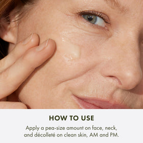 Origins Plantscription bottle beside moisturizer, suggests layered skincare routine benefit