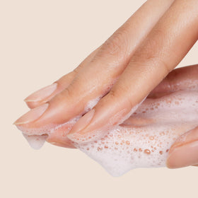 Origins dispensing cleanser from tube to hand to show easy application
