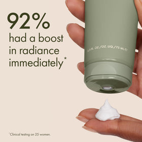 Origins face scrub in hand demonstrating creamy texture and easy application