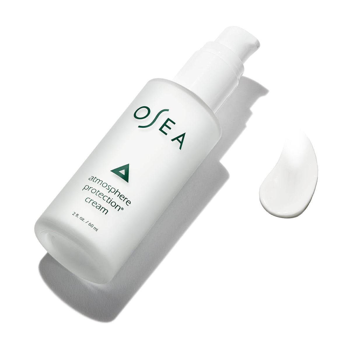 OSEA Atmosphere Protection 2oz next to common items to show compact travel-friendly size