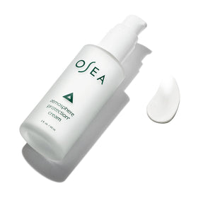 OSEA Atmosphere Protection 2oz next to common items to show compact travel-friendly size