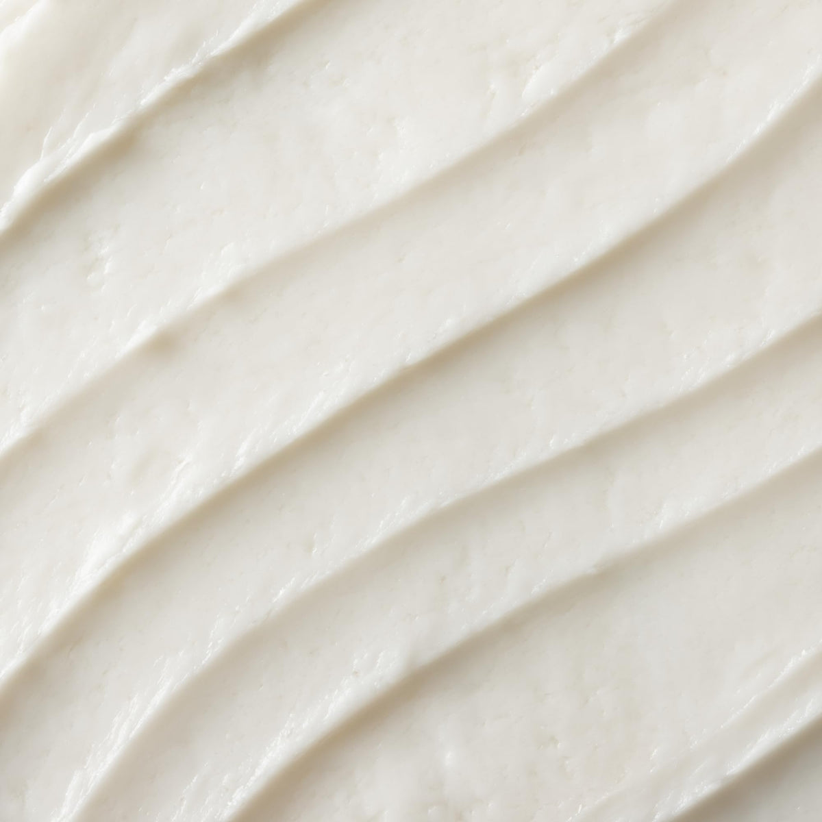 OSEA cream applied on hand demonstrating lightweight absorbent texture
