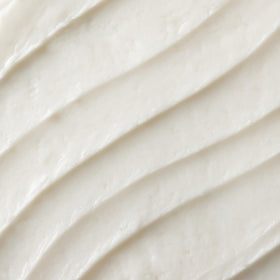OSEA cream applied on hand demonstrating lightweight absorbent texture
