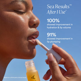 OSEA lip oil in hand showing size and scale for portable daily use benefit