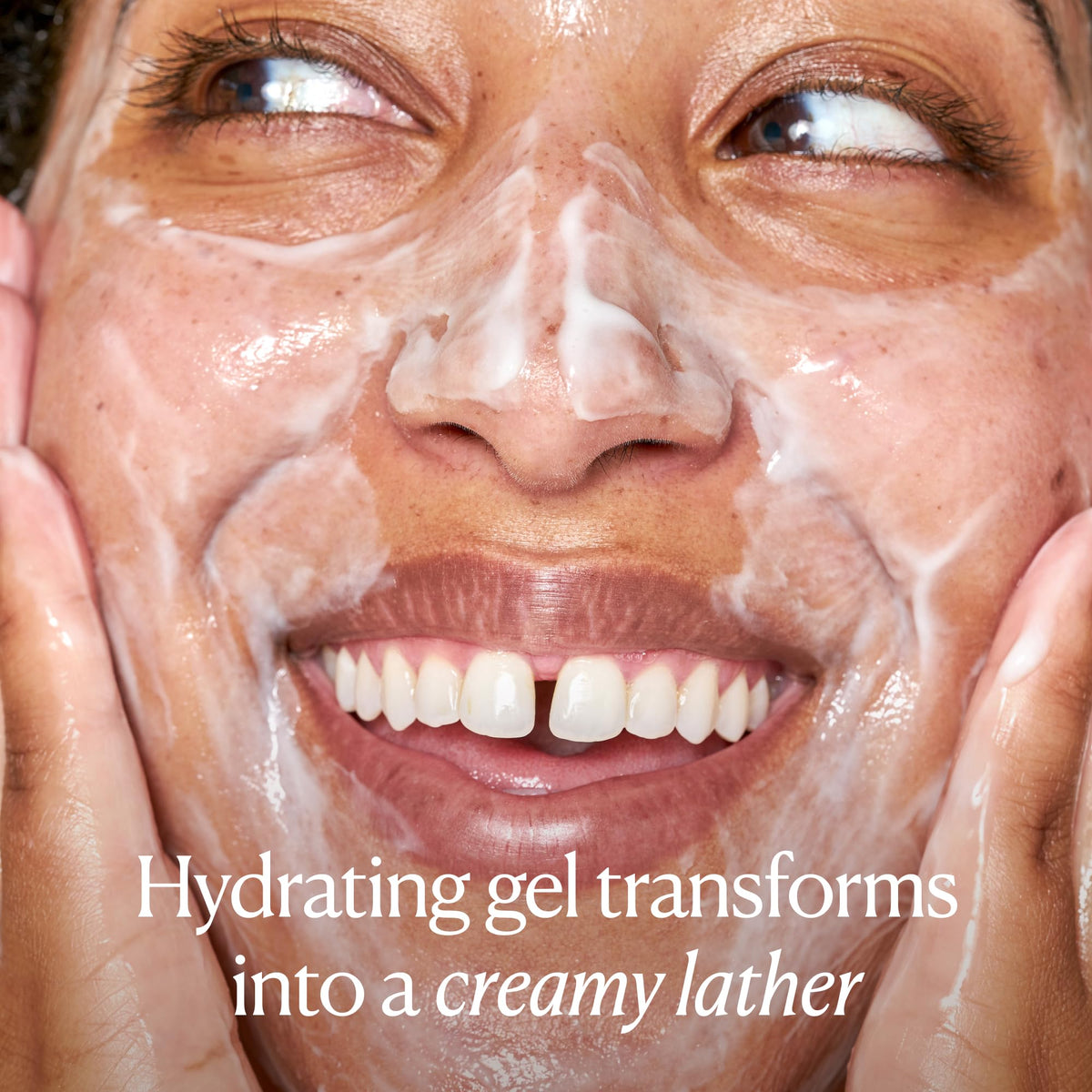 OSEA Ocean Cleanser being dispensed into palm demonstrating easy application and lather