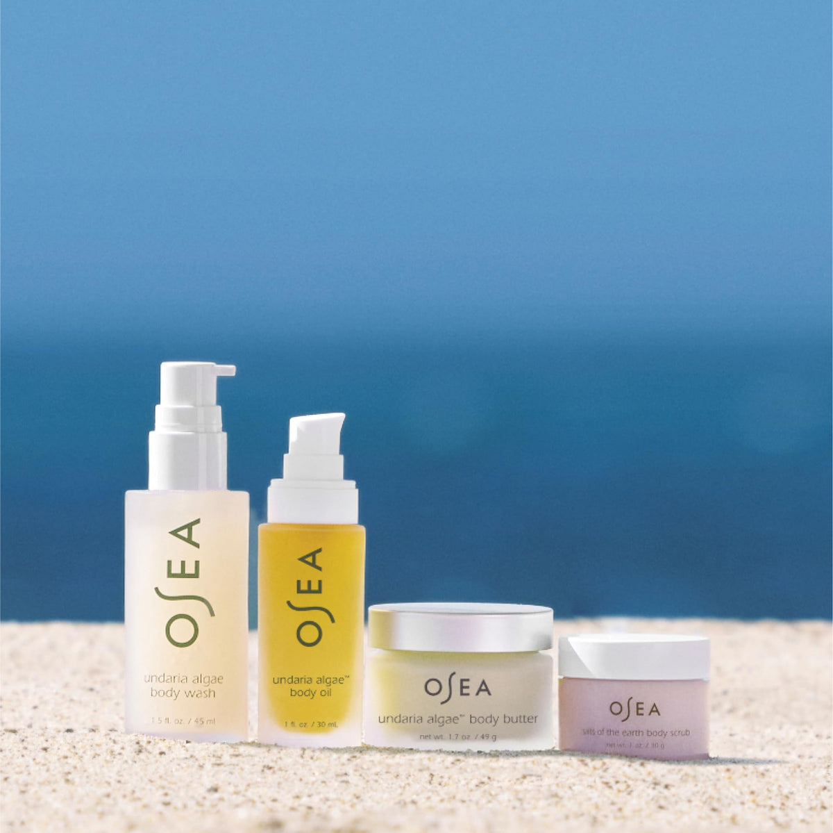 OSEA salts of the earth scrub in hand demonstrating exfoliation and softened skin