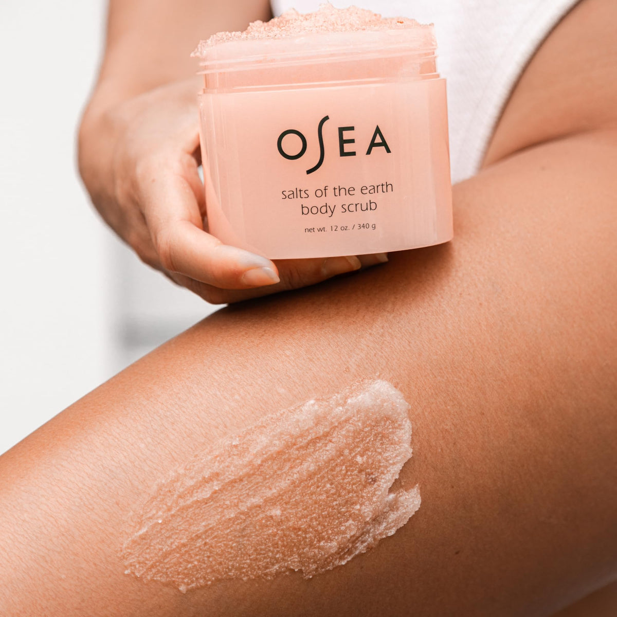 OSEA close-up texture of pink Himalayan salt scrub revealing exfoliating crystals and smooth finish