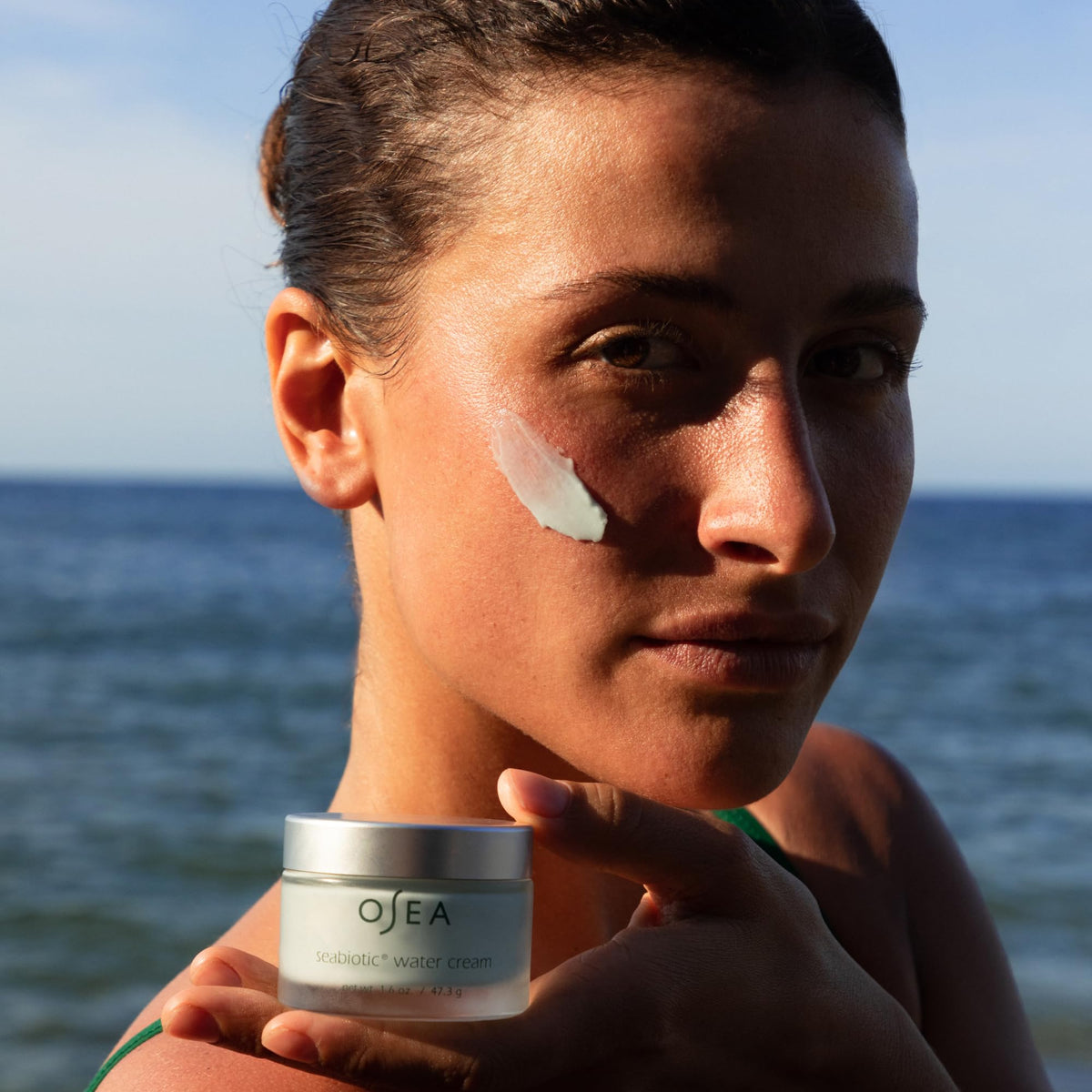 OSEA Seabiotic on bathroom shelf in lifestyle scene signaling clean, sustainable skincare