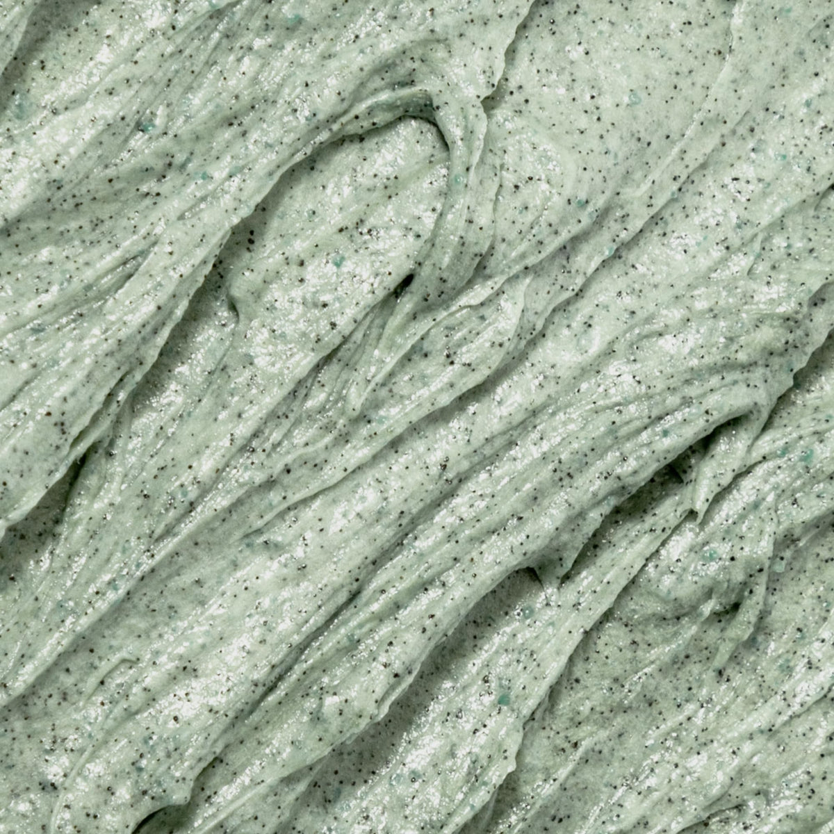 OSEA Seaglow scrub applied to hand demonstrating polish and easy rinse-off