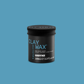 Osmo clay wax lifestyle mirror shot styled hair showing matte texture and volume