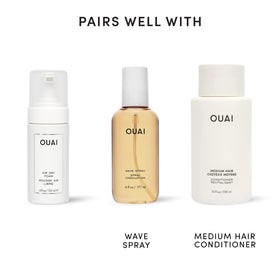 OUAI 4 oz mousse next to common items for scale and travel convenience