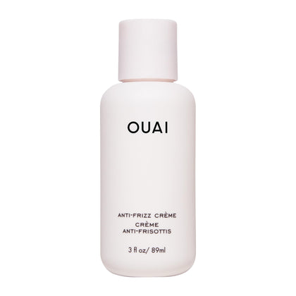 OUAI anti frizz cream front packaging shows compact travel tube and branding benefit frizz control