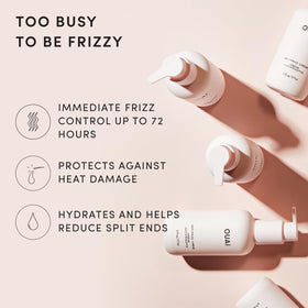 OUAI anti frizz cream texture on palm illustrating lightweight creamy formula and easy spreadability