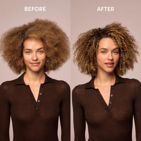 OUAI applying bond repair balm from mid-length to ends to rebuild strands