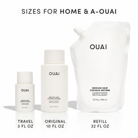 OUAI conditioner held in hand next to coin for size comparison and portability