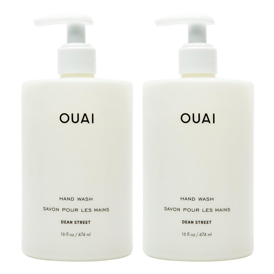 OUAI Dean Street full-size bottle front view showing label and sleek design benefit: clear product ID