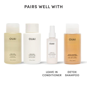 OUAI bottle label closeup highlighting sulfate-free and paraben-free formula