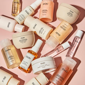 OUAI applying conditioner to mid-lengths and ends to detangle and boost body