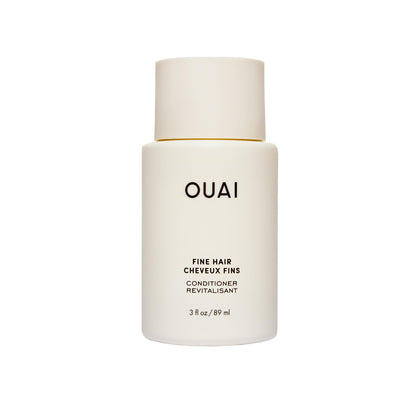 OUAI front packaging of travel conditioner showing bottle and branding, easy-packing benefit