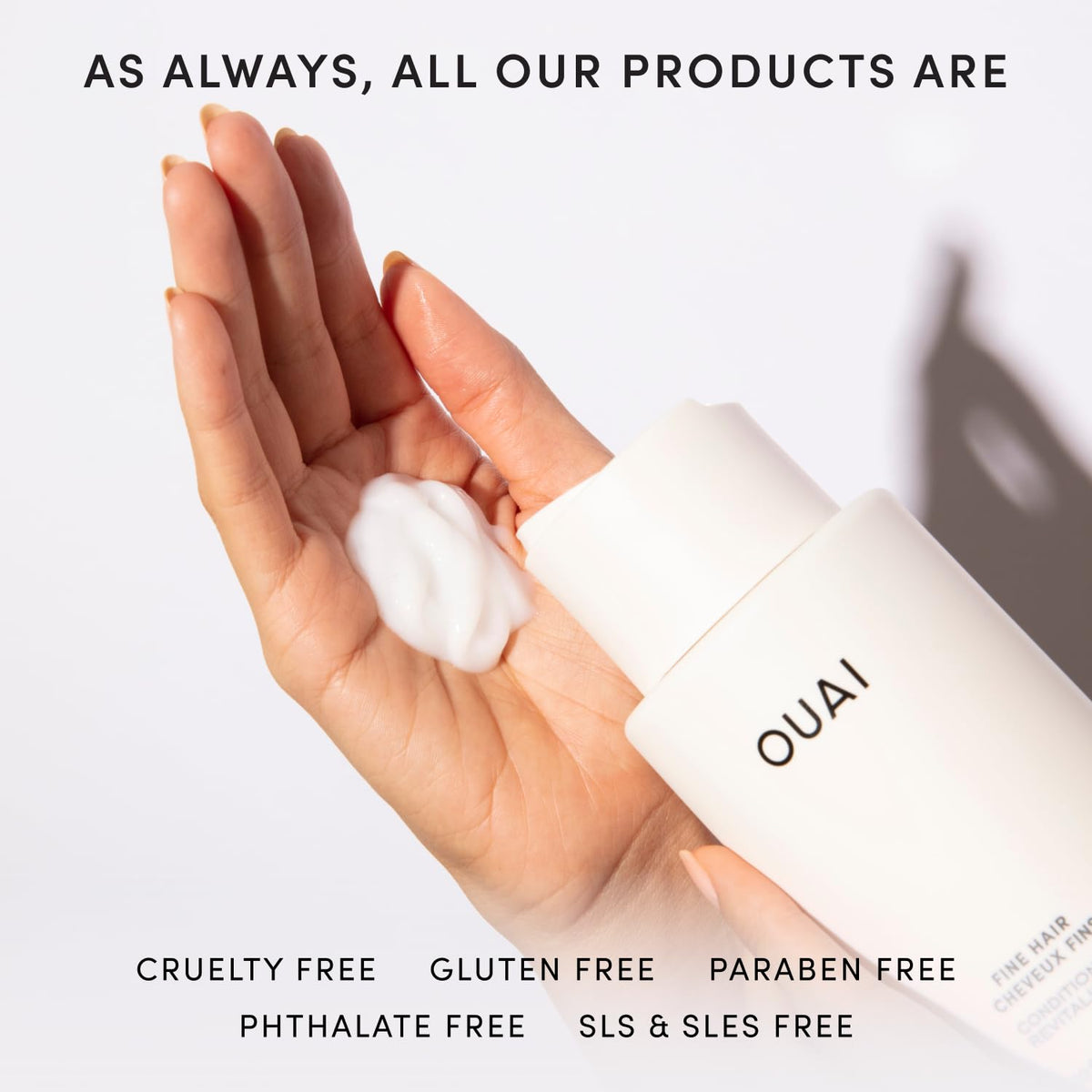 OUAI refill next to hand for scale showing 32 oz generous supply