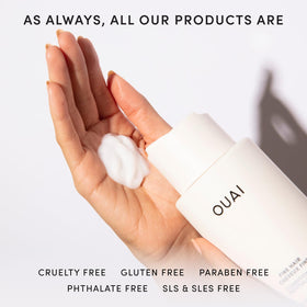 OUAI refill next to hand for scale showing 32 oz generous supply