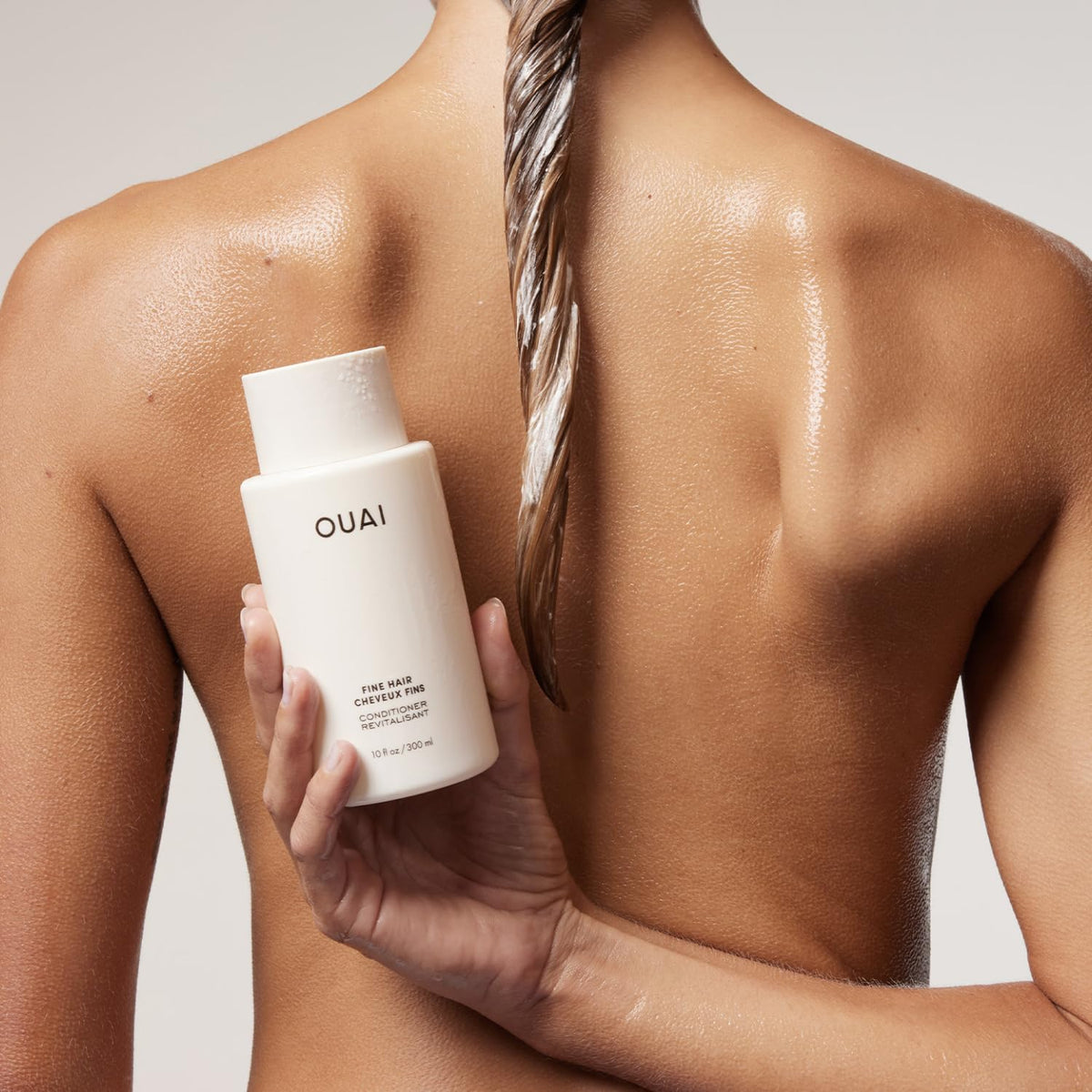 OUAI conditioner texture swatch highlighting lightweight creamy consistency
