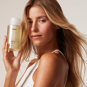 OUAI shampoo paired with Fine Conditioner to lock in lightweight volume