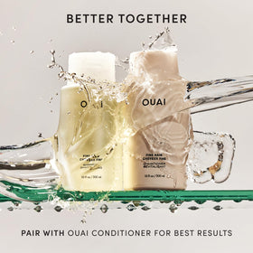 OUAI 32 oz bottle next to smaller bottle showing long-lasting value