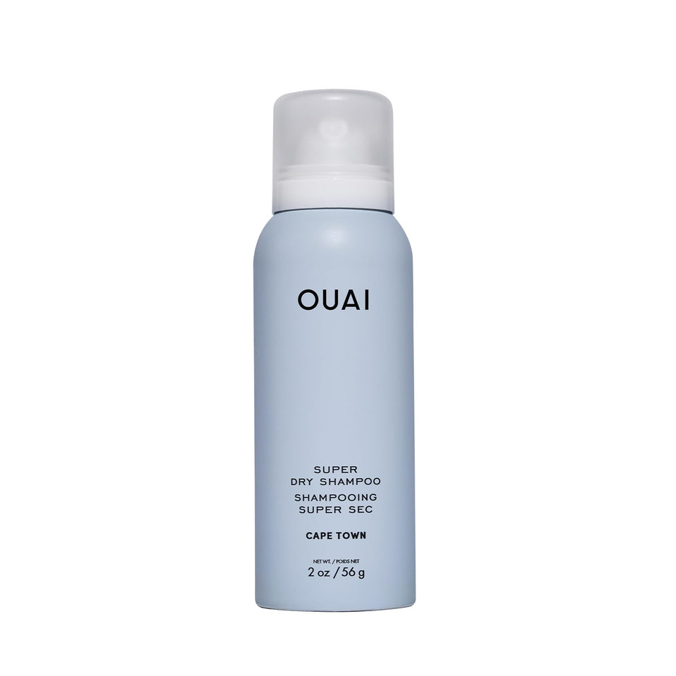 OUAI front packaging of 2 oz travel dry shampoo showing compact can and branding for easy carry