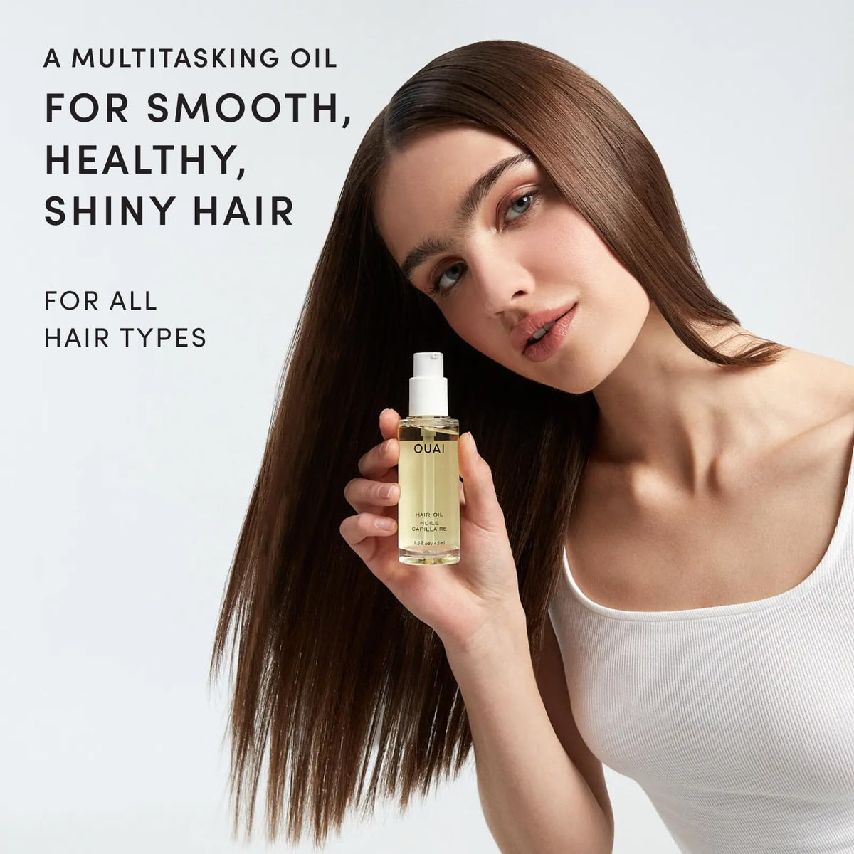 OUAI hair oil pipette close-up dispensing drops for precise control