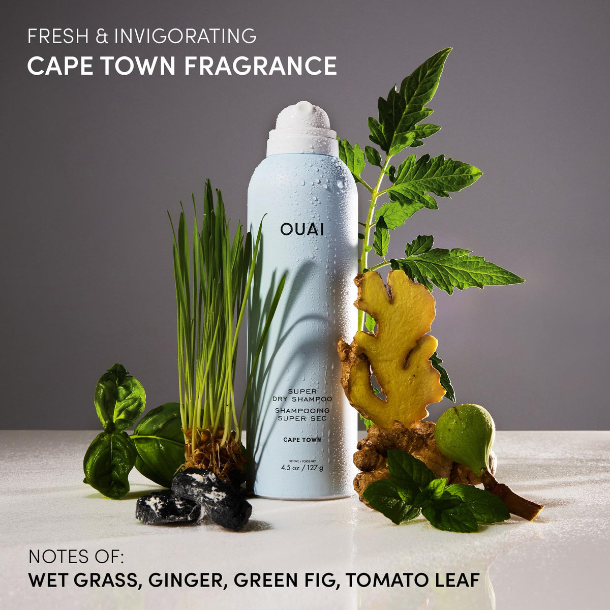 OUAI travel size in hand for scale to show 2 oz portability and TSA-friendly convenience
