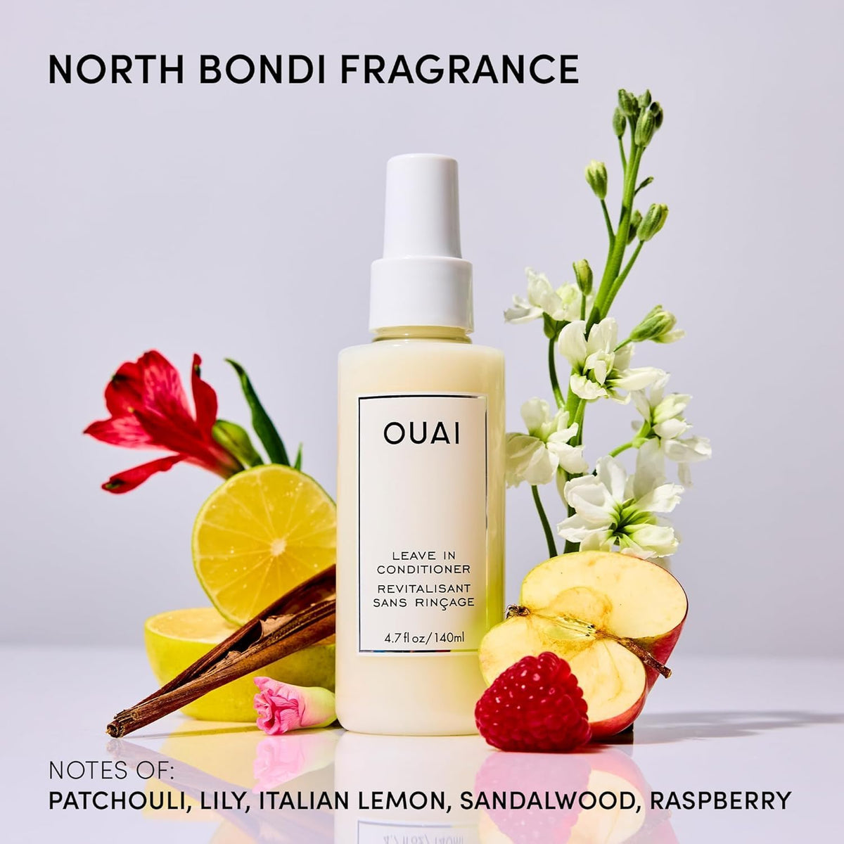 OUAI bottle in hand illustrating compact travel-friendly scale