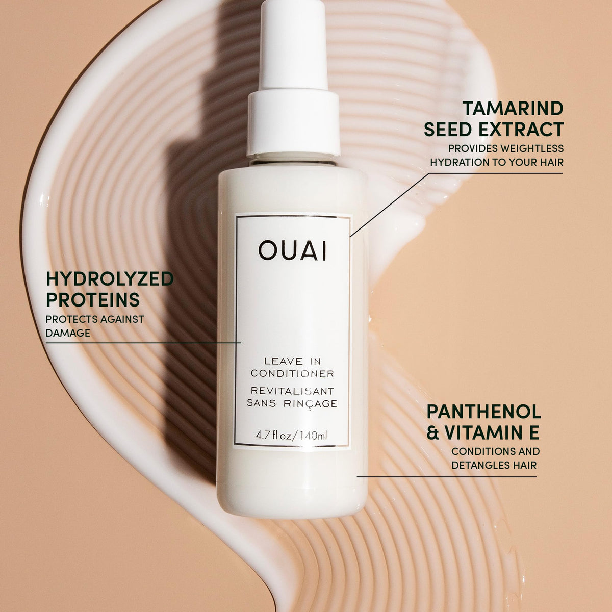 OUAI leave-in mist on hair strand showing slip and smoother-looking ends