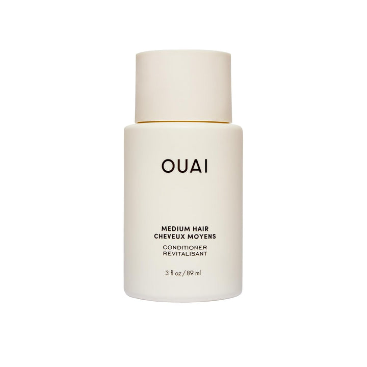 OUAI medium conditioner front tube showing compact travel-friendly design and benefits