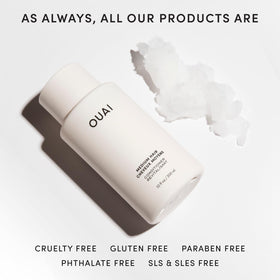 OUAI 32 oz refill next to hand for scale, highlights value and bulk supply