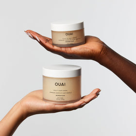 OUAI jar next to travel items showing compact size convenience