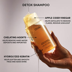 OUAI kit held in hand for scale showing travel-friendly sizes and portability benefits
