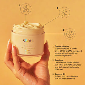 OUAI hair and body mist being sprayed with instant tropical scent refresh