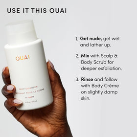 OUAI in hand for scale, shows 10 fl oz size and travel-friendly convenience