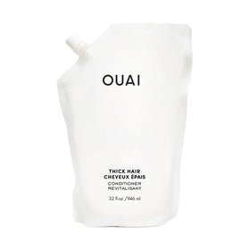 OUAI refill front label showing product name and size, clear benefits